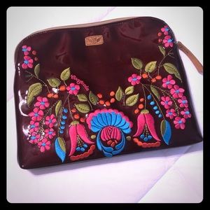 Consuela zippered pouch with leather handle strap